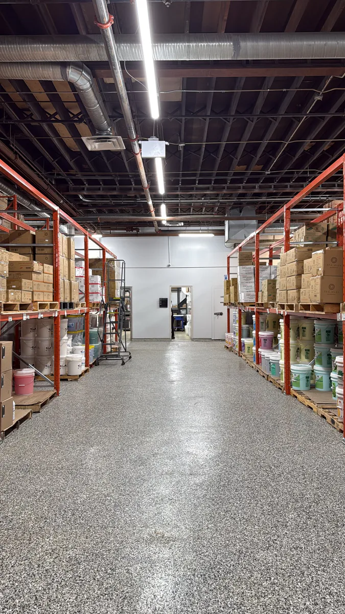 Completed Supply & Apply warehouse with stocked pallet racking and a clear central aisle.